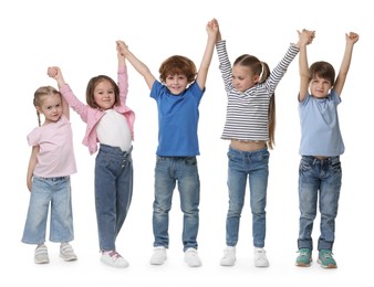 Group of cute children holding hands on white background