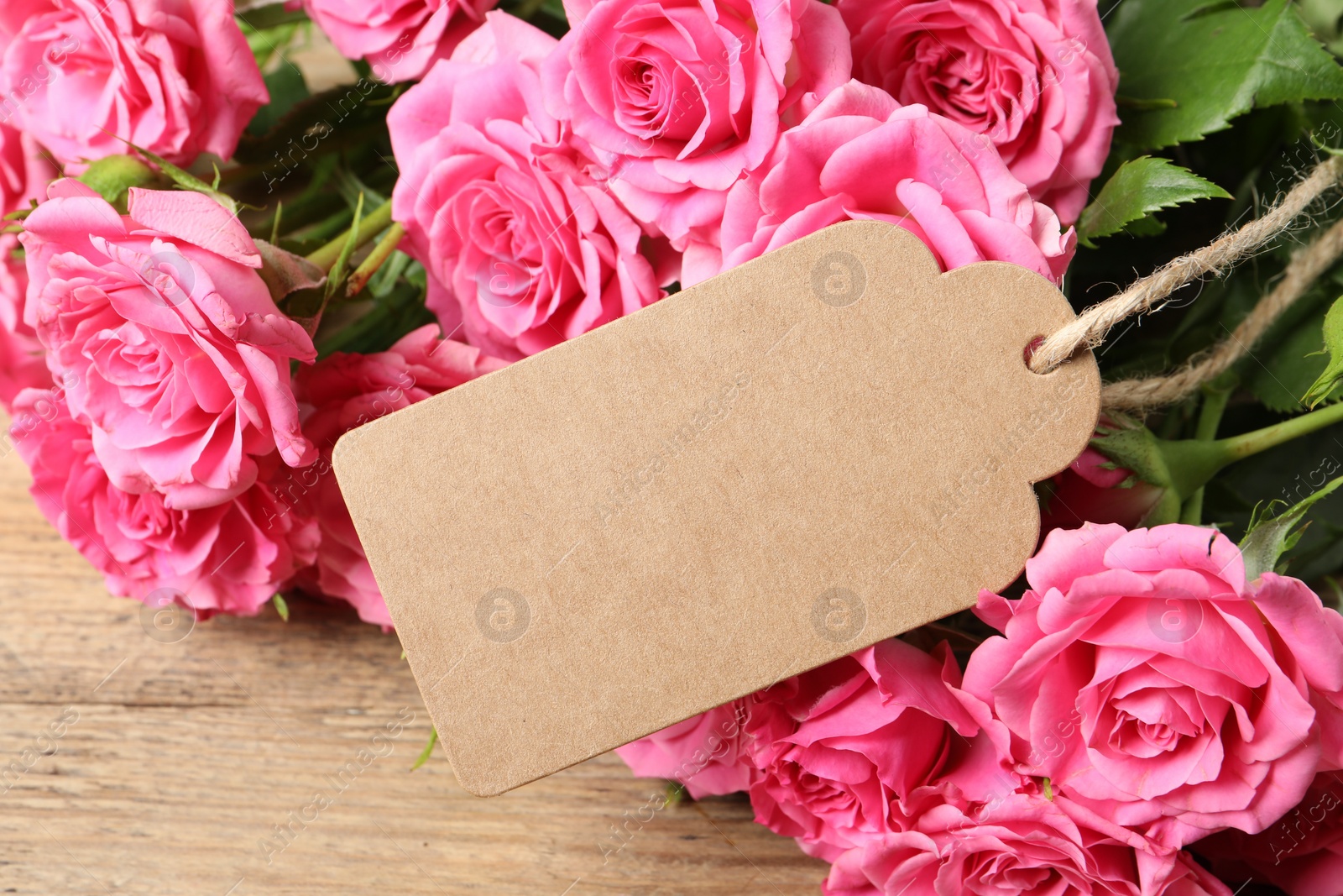 Photo of Happy Mother's Day. Beautiful flowers and blank card on wooden table, closeup