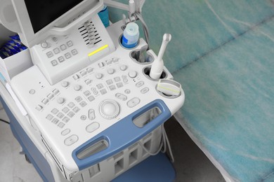 Photo of Ultrasound machine and examination table in hospital, above view