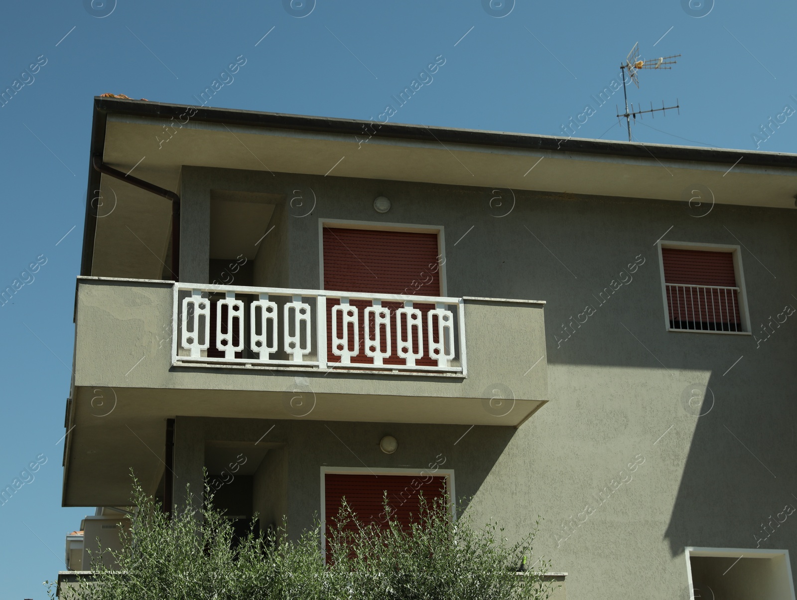 Photo of Exterior of residential building with balconies on sunny day, low angle view