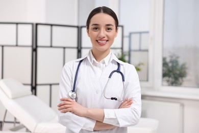 Photo of Portrait of medical consultant with stethoscope in clinic