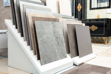 Many different samples of tiles on display in store