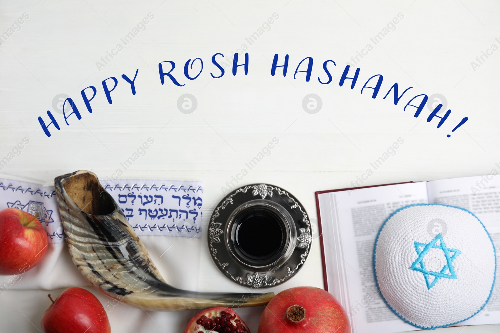 Image of Flat lay composition with Rosh Hashanah holiday attributes and words Blessed Are You, Lord Our God, King Of The Universe, Who Has Sanctified Us With His Commandments, And Commanded Us To Enwrap Ourselves In Tzitziton in Hebrew on white wooden table
