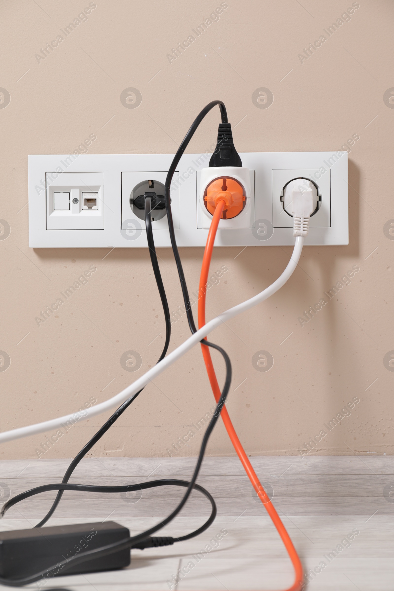 Photo of Many different electrical power plugs in sockets indoors