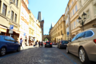 Photo of PRAGUE, CZECH REPUBLIC - APRIL 25, 2019: Blurred view of city street with old buildings