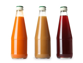 Photo of Bottles with different drinks on white background