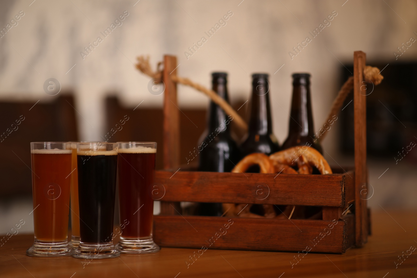 Photo of Beer tasting set served on wooden table