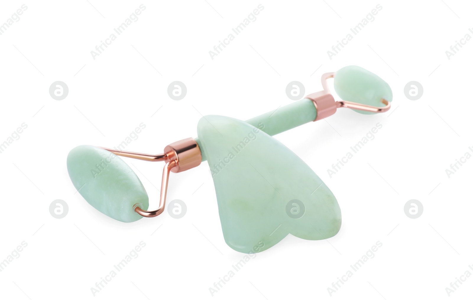 Photo of Jade gua sha tool and facial roller isolated on white