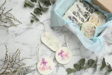 Photo of Flat lay composition with scented sachets on white marble table