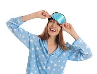 Beautiful woman wearing pajamas and sleep mask on white background. Bedtime