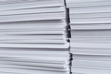 Photo of Stacks of white paper sheets, closeup view