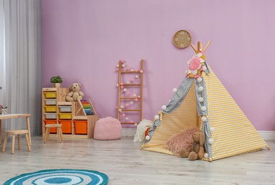 Modern nursery room interior with play tent for kids