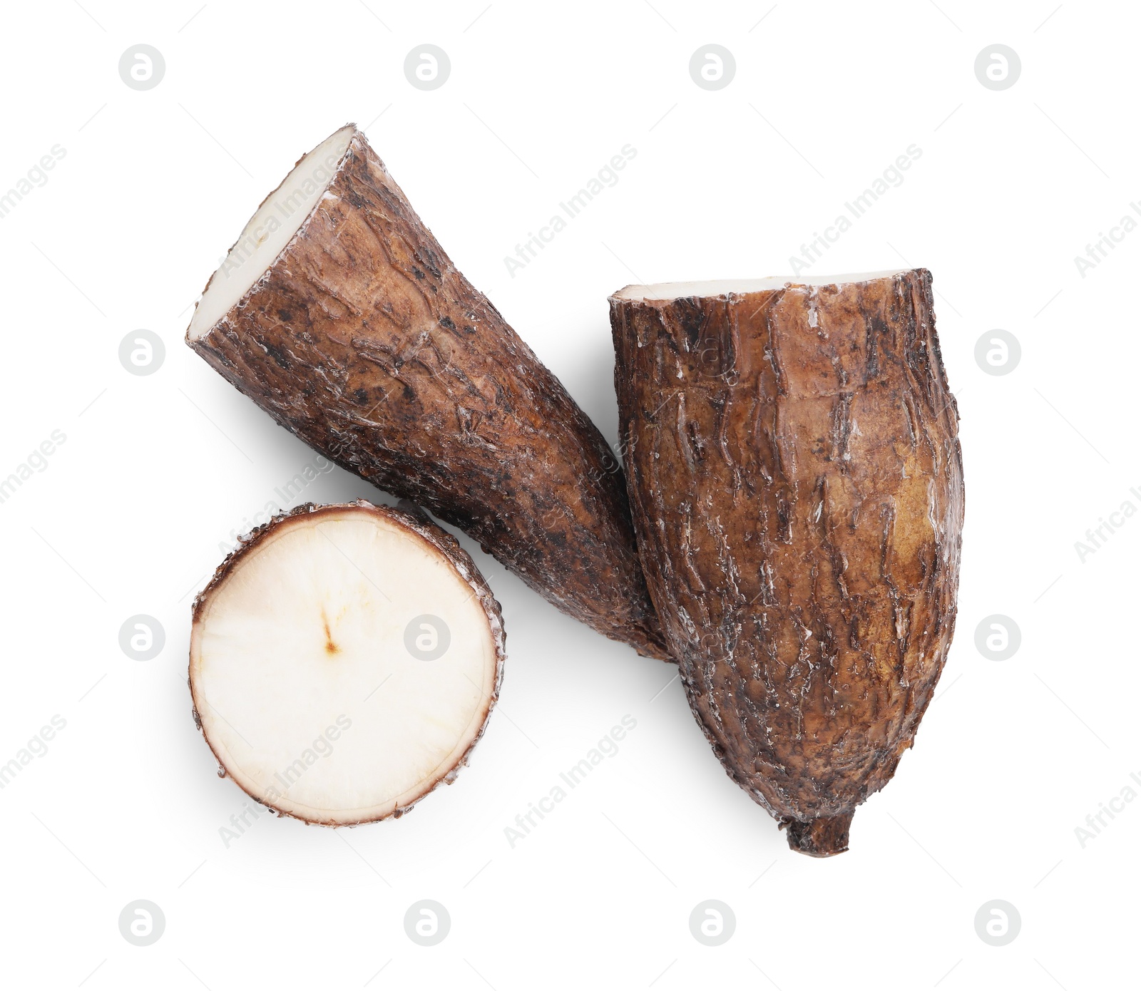 Photo of Pieces of cassava root isolated on white, top view