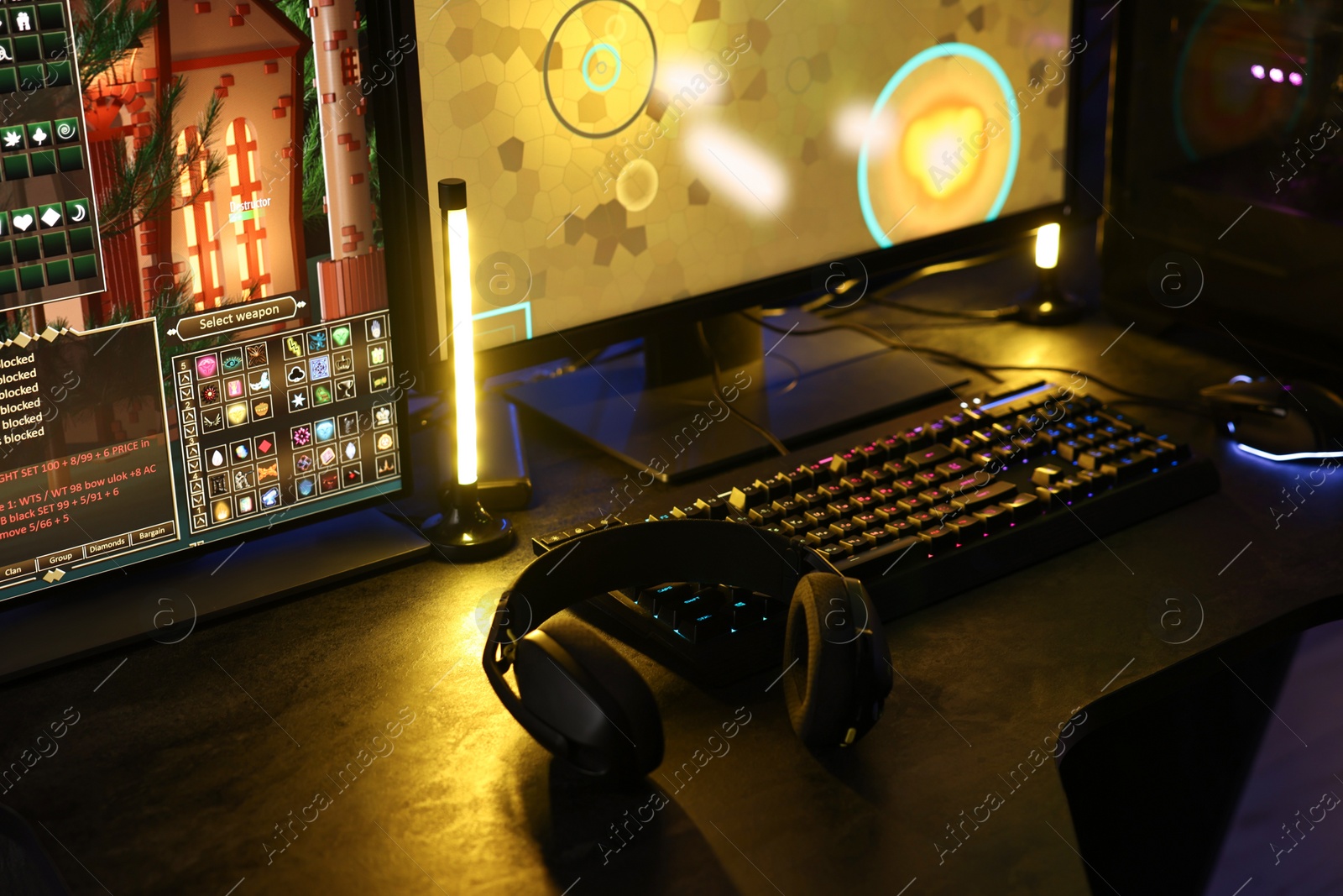 Photo of Playing video games. Computer monitor, keyboard, mouse and headphones on table indoors