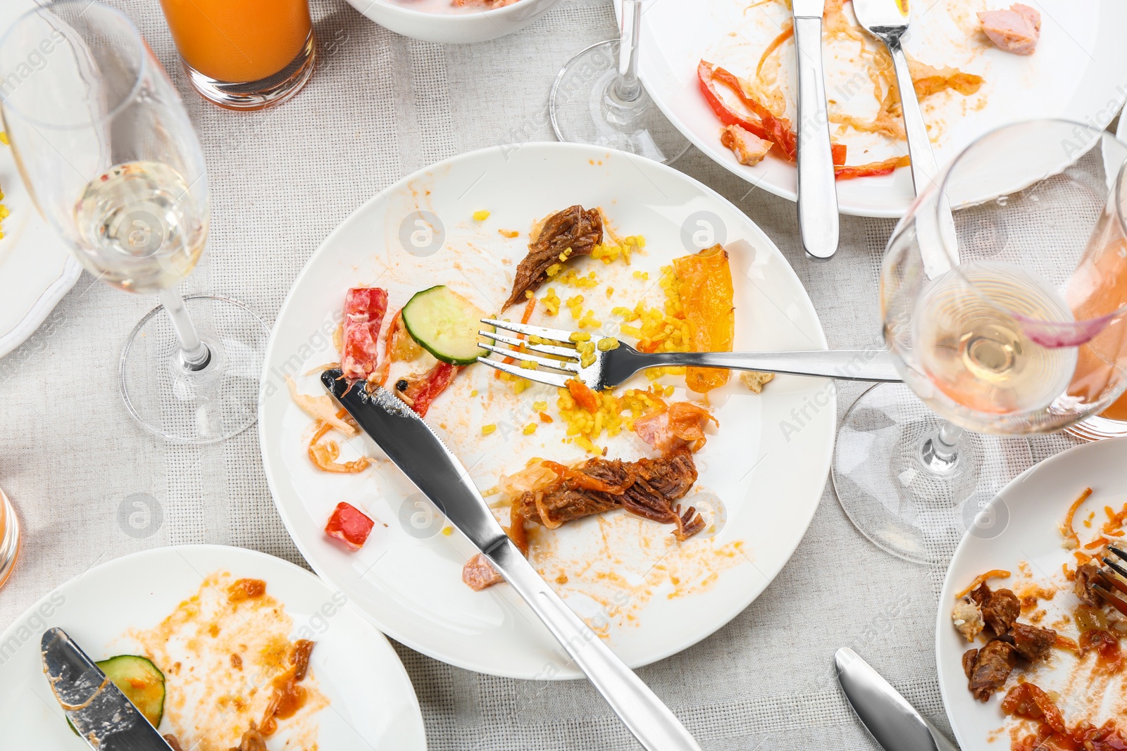 Photo of Composition with food leftovers after party on table, above view