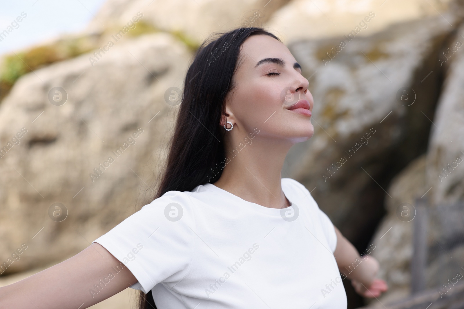 Photo of Beautiful woman enjoying feeling of freedom outdoors
