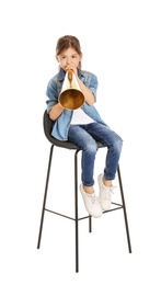 Photo of Adorable little girl with vintage megaphone on white background