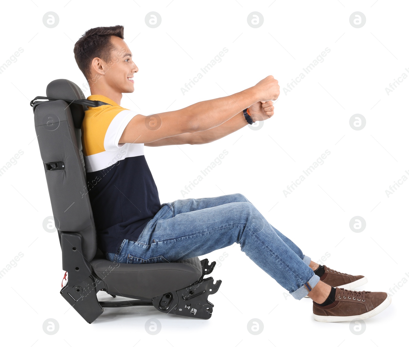 Photo of Young man sitting in car seat with safety belt on white background