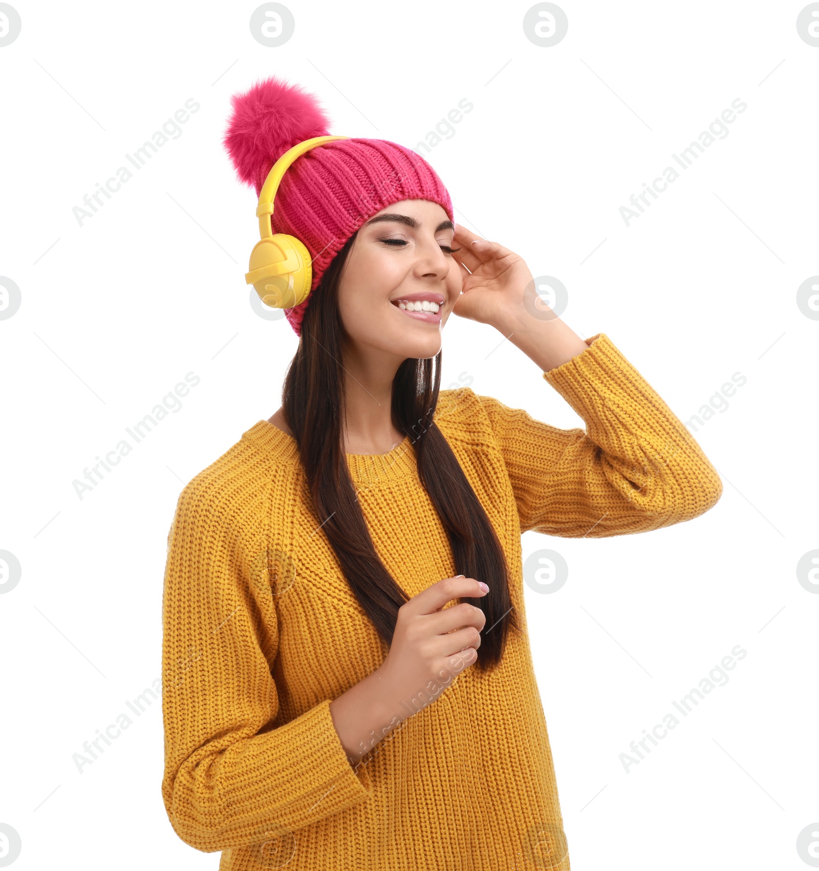 Photo of Young woman listening to music with headphones on white background