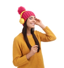 Photo of Young woman listening to music with headphones on white background