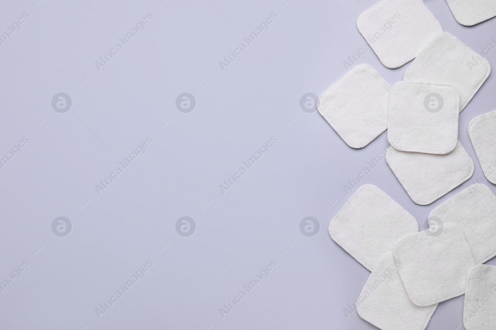 Photo of Many clean cotton pads on light grey background, flat lay. Space for text