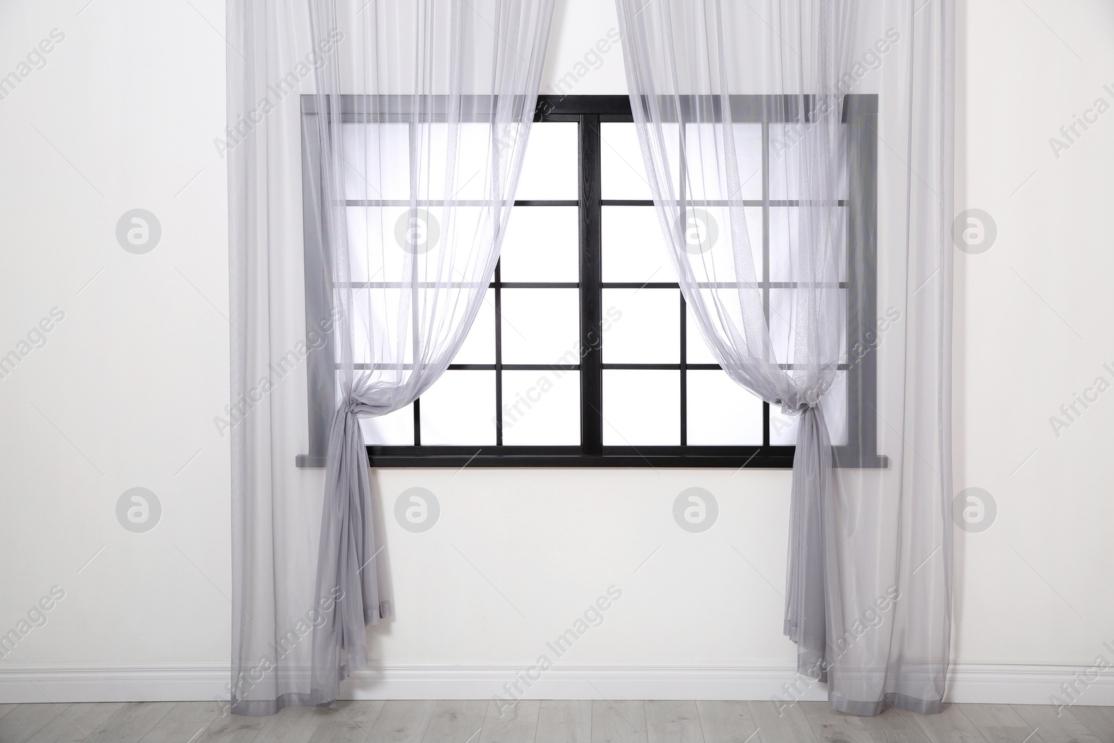 Photo of Modern window with glass and curtains in room. Home interior