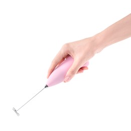 Woman holding pink milk frother wand on white background, closeup