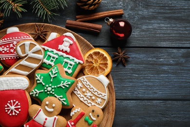 Photo of Tasty homemade Christmas cookies on dark blue wooden table, top view