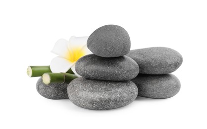 Photo of Spa stones with flower and bamboo stems isolated on white