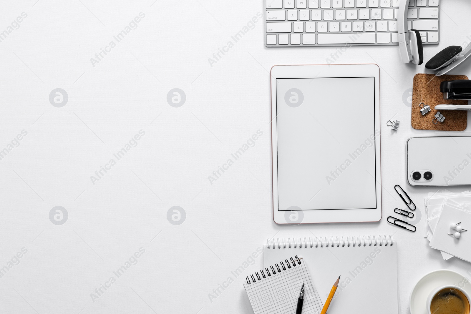 Photo of Flat lay composition with modern tablet on white background. Space for text