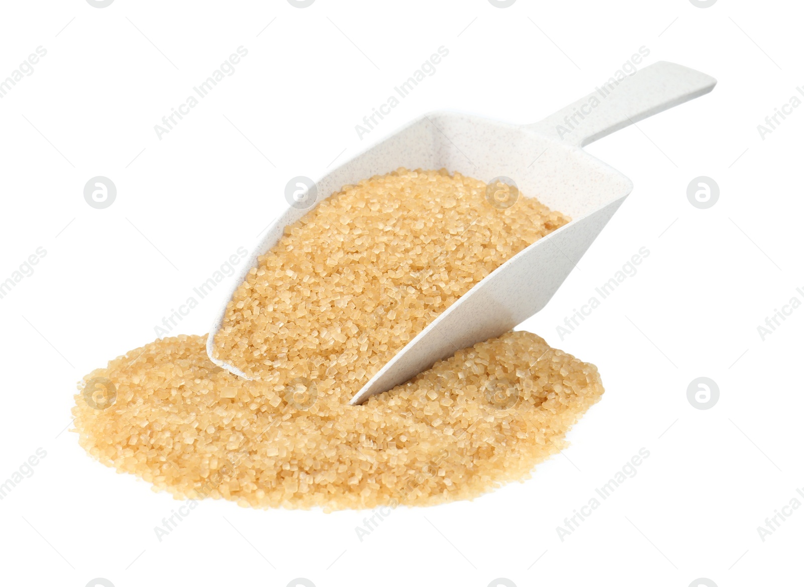 Photo of Pile of brown sugar and scoop isolated on white