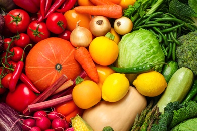 Photo of Many fresh vegetables as background, top view