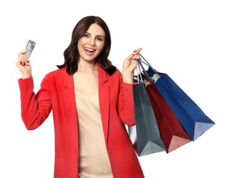 Beautiful young woman with paper shopping bags and credit card on white background