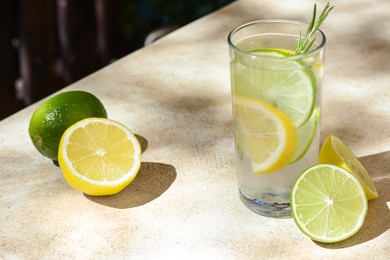 Summer refreshing lemonade and ingredients on light table, space for text