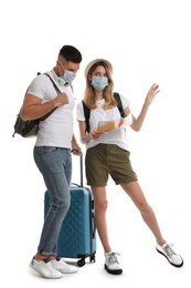 Couple in face masks with map on white background. Summer travel