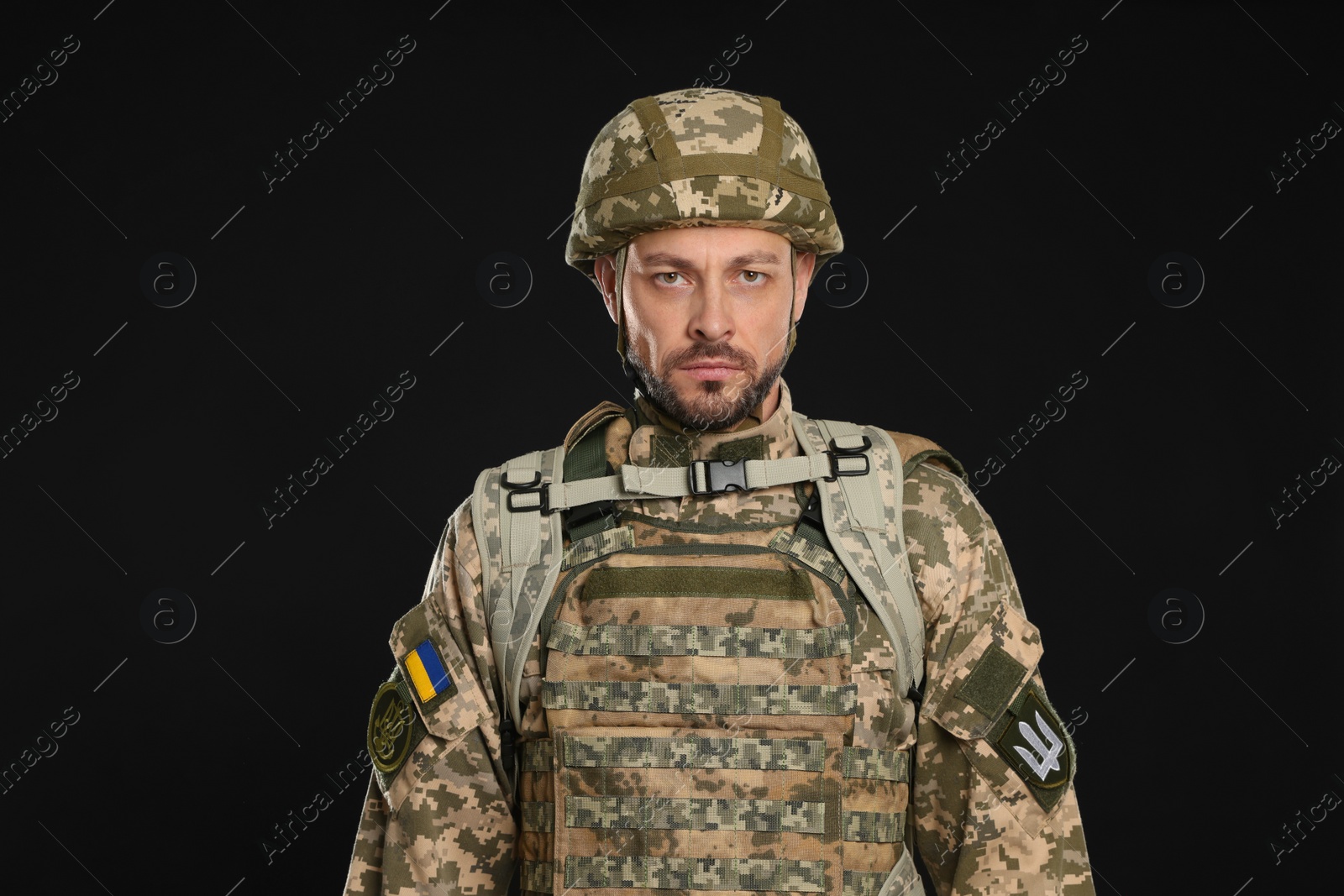 Photo of Soldier in Ukrainian military uniform on black background