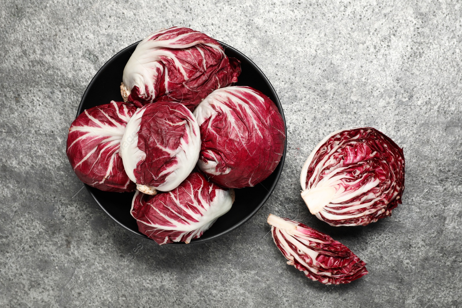 Photo of Whole fresh ripe radicchios on grey table, flat lay