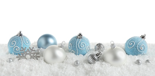 Christmas tree decoration on artificial snow against white background