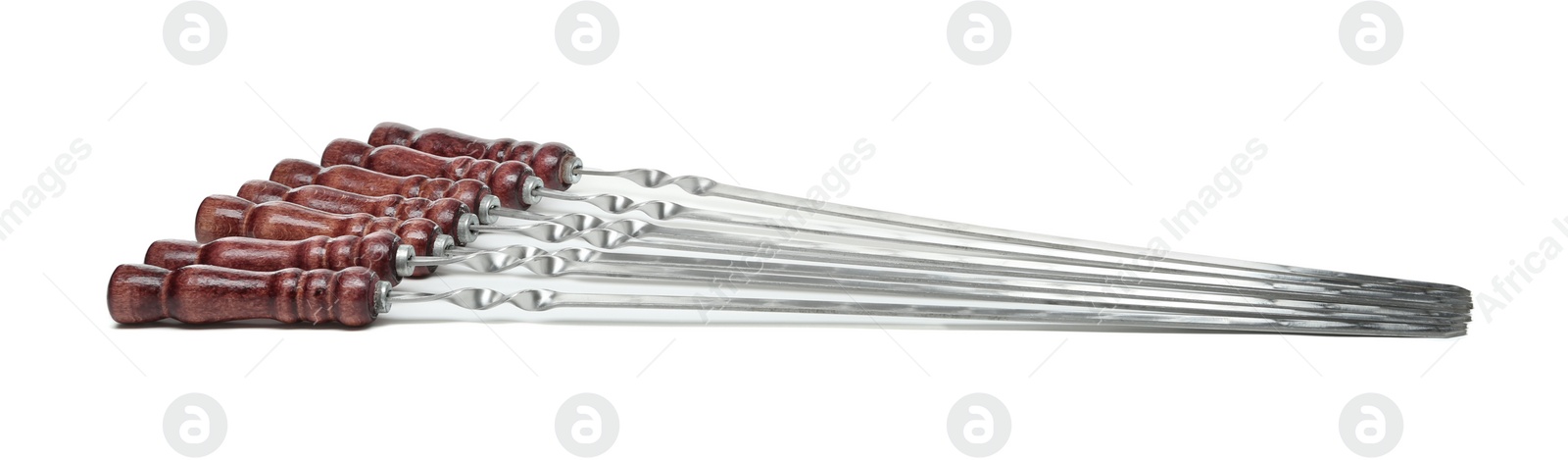 Photo of Metal skewers with wooden handle on white background