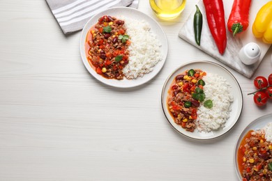 Photo of Rice with chili con carne on white wooden table, flat lay. Space for text