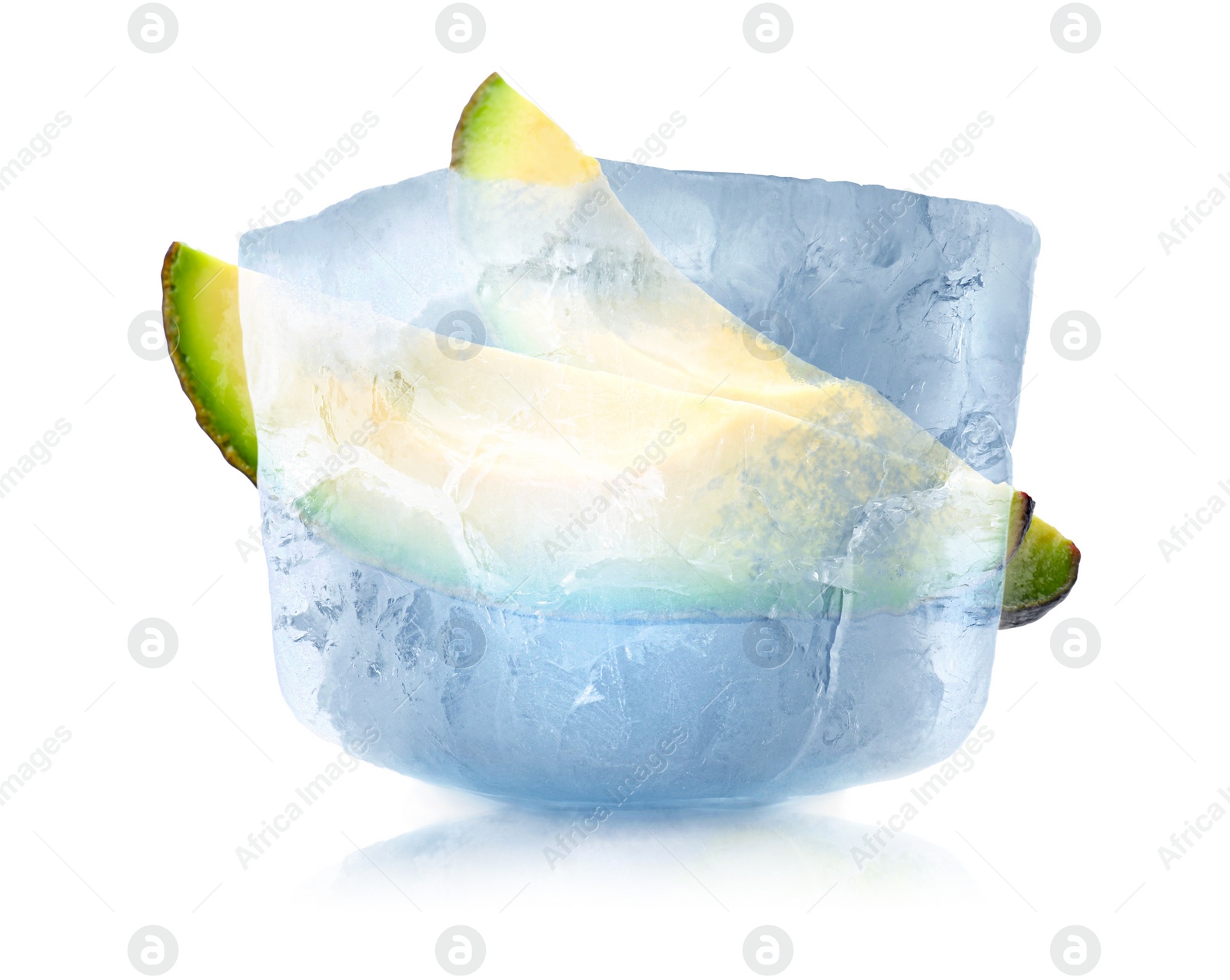 Image of Frozen food. Raw avocado in ice cube isolated on white