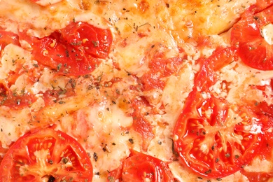 Hot cheese pizza Margherita as background, top view