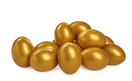 Photo of Many shiny golden eggs on white background