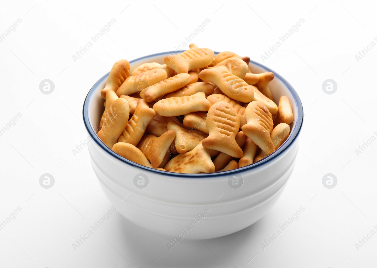 Photo of Delicious goldfish crackers in bowl isolated on white