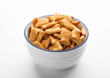 Photo of Delicious goldfish crackers in bowl isolated on white