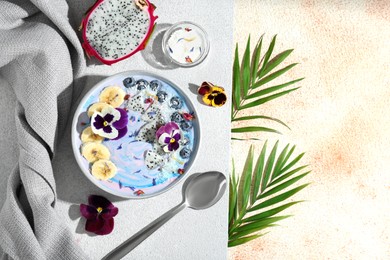 Delicious smoothie bowl with fresh fruits, blueberries and flowers served on color textured table, flat lay. Space for text