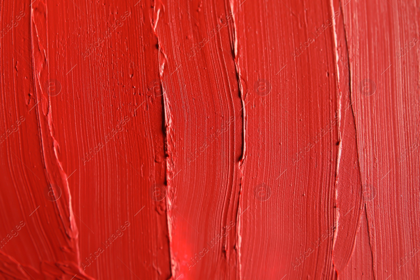 Photo of Red lipstick smears as background, closeup. Cosmetic product