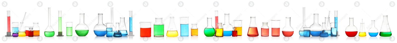 Image of Set of laboratory glassware with colorful liquids on white background. Banner design