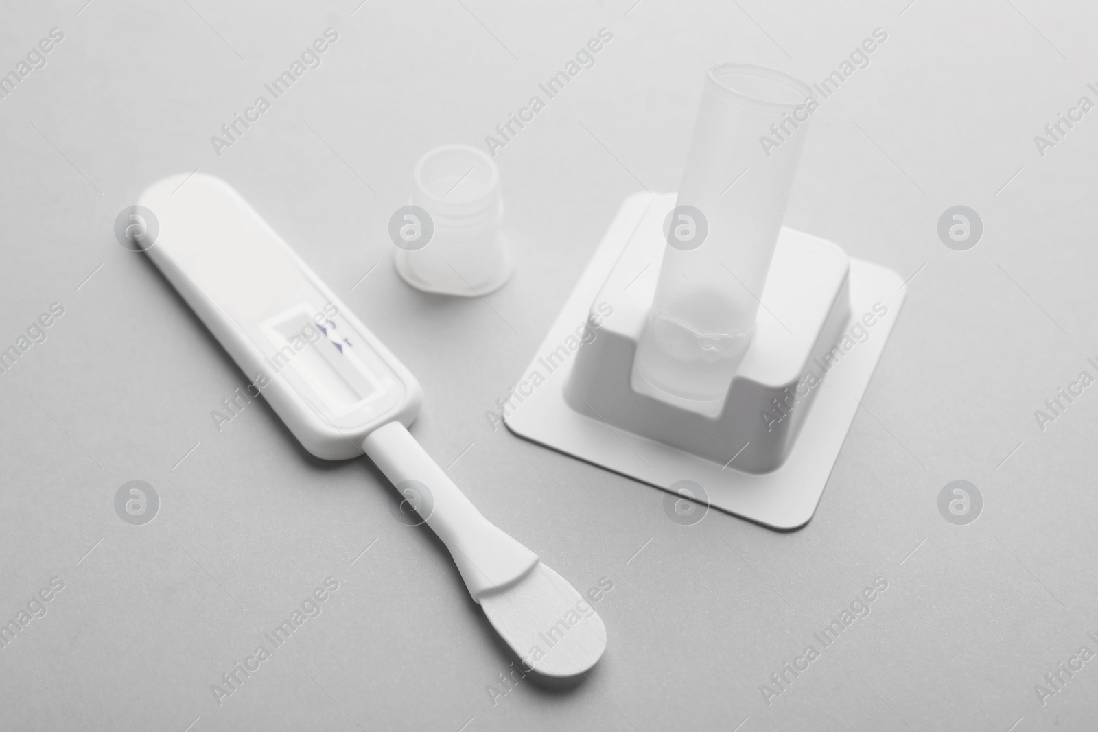 Photo of Disposable express test kit on light grey background