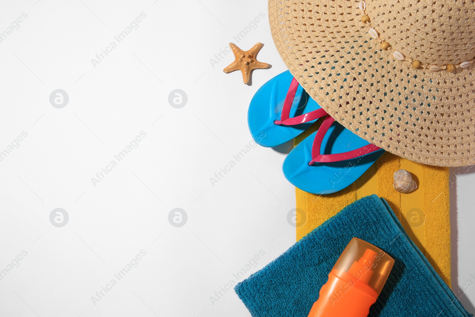 Photo of Flat lay composition with beach accessories on white background, space for text